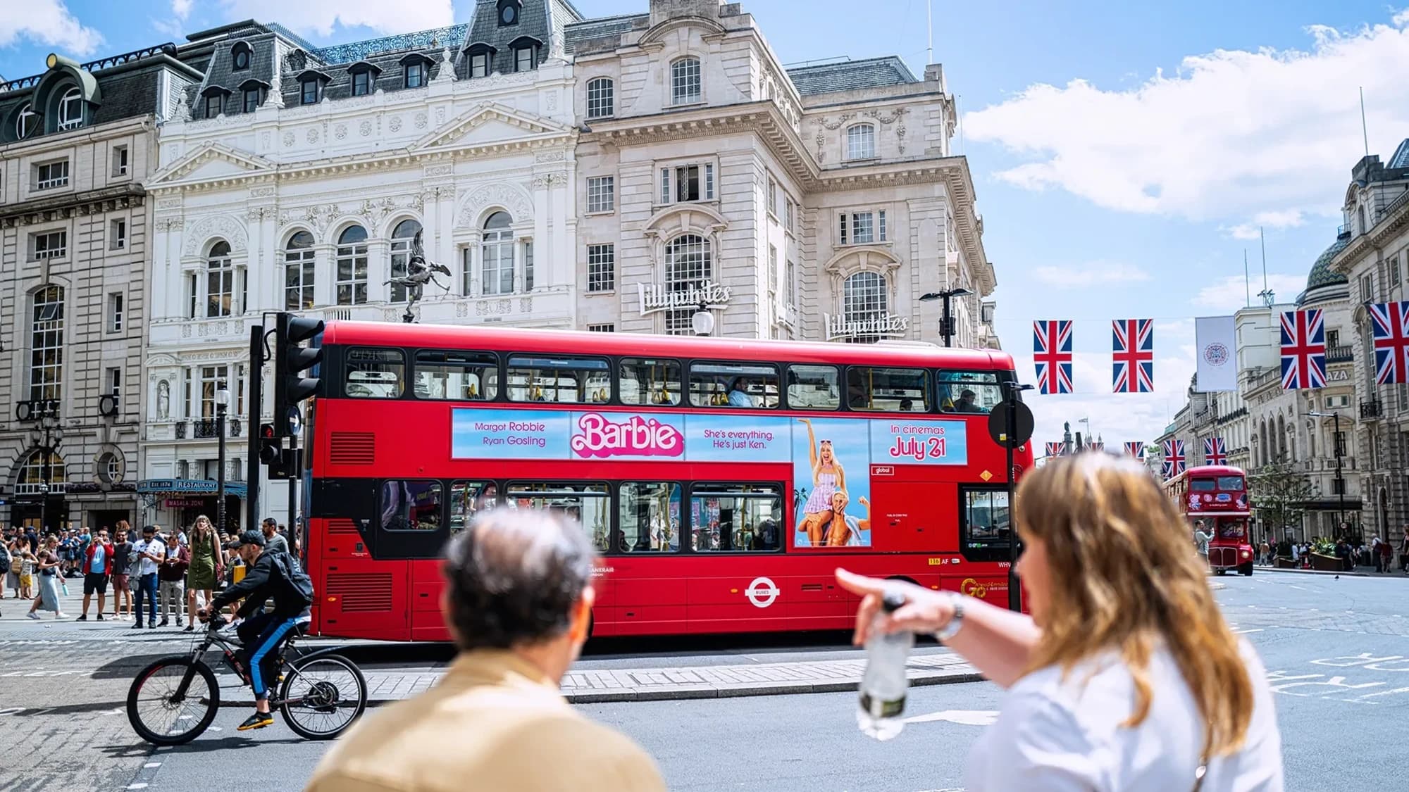 Bus advertising: a wrap in sushi imagery carries the Menulog line, You do staying in, we'll do sushi.