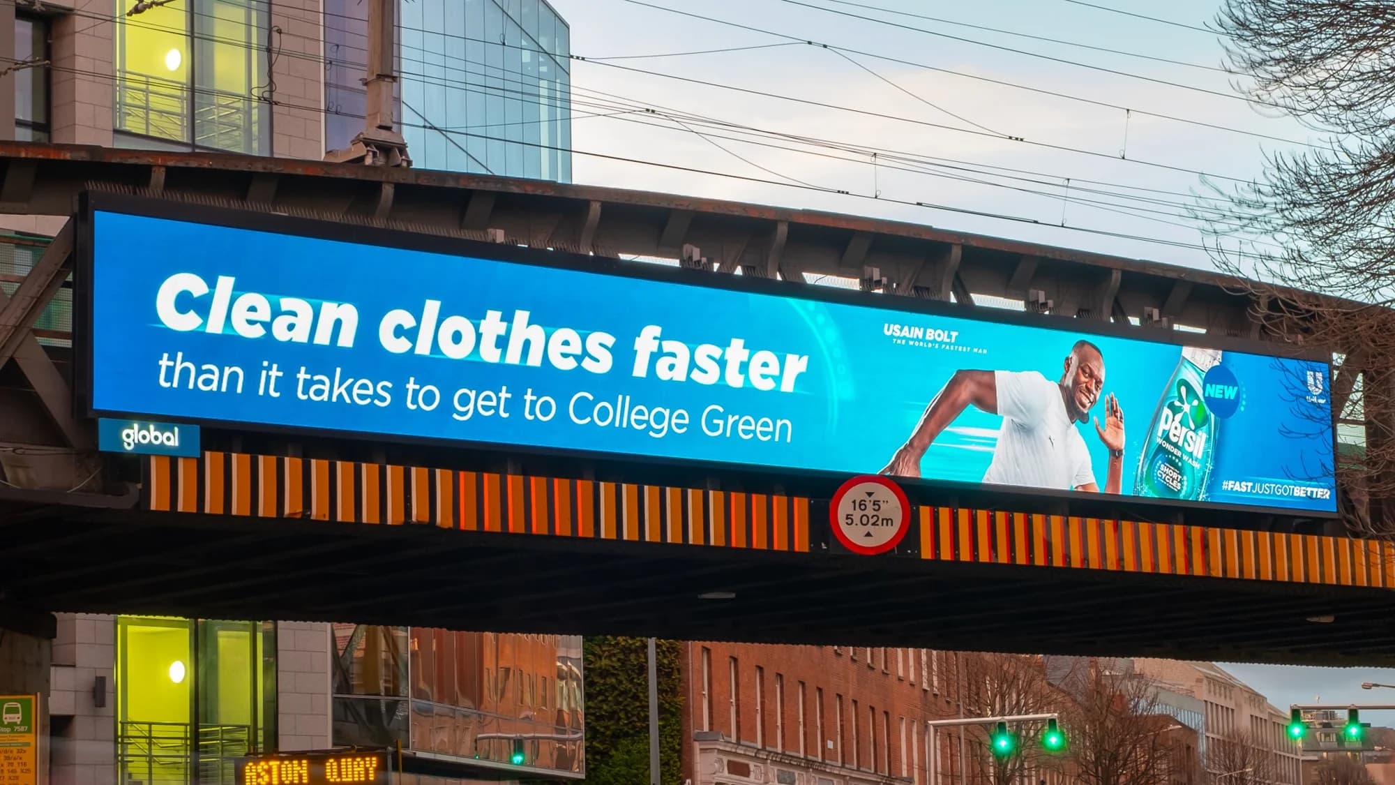 Digital billboard advertising in Ireland: a screen above a SPAR shop advertises Skyr with the lines This is breakfast and Naturally high in protein.