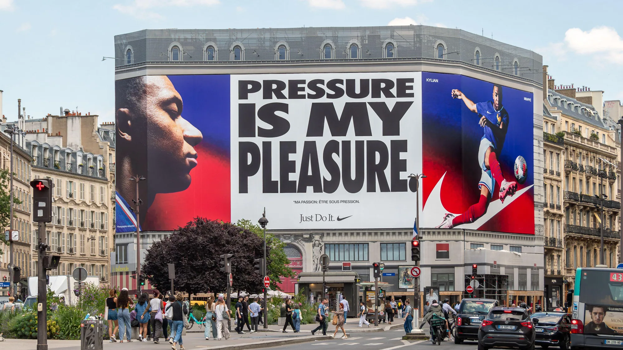 Billboard advertising in Paris, in France: a building wrap shows Nike's Pressure is my pleasure campaign, with Kylian Mbappé and Just Do It.