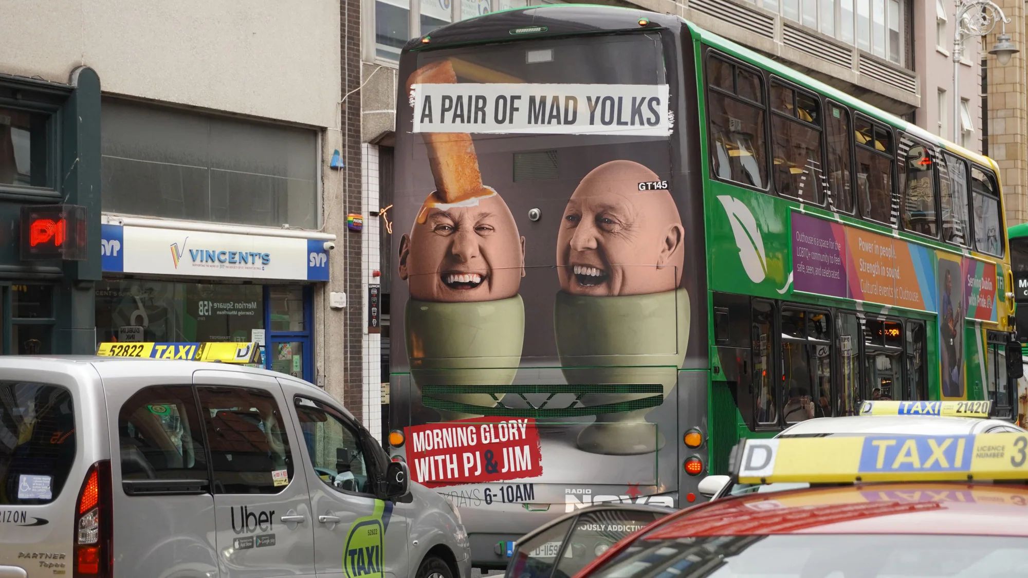 Bus advertising in Ireland: the back of a double-decker shows A pair of mad yolks, for Radio Nova's Morning Glory with PJ and Jim.