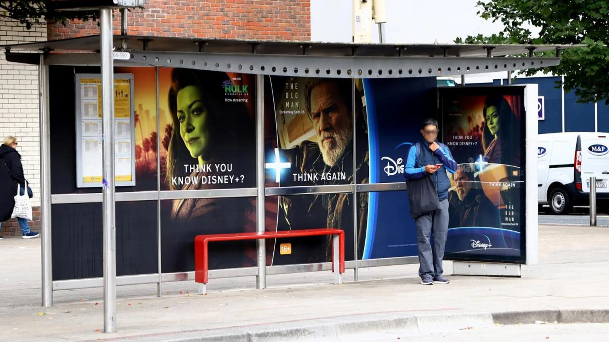 Street furniture advertising in Ireland: a bus shelter is covered with Disney+ posters asking, Think you know Disney+? Think again.