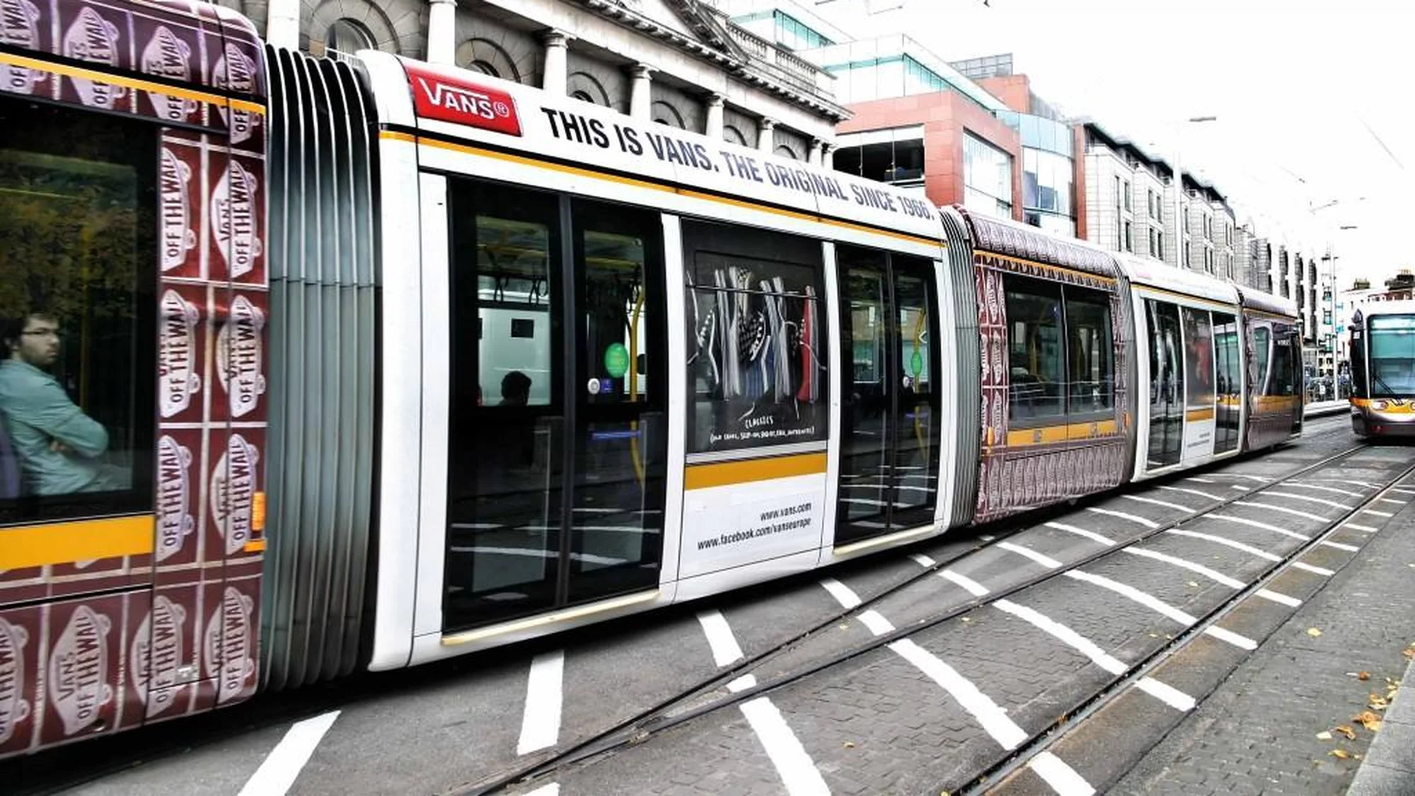 Tram advertising in Ireland: a tram is wrapped in Vans advertising, with Off the Wall checks and the line This is Vans, the original since 1966.
