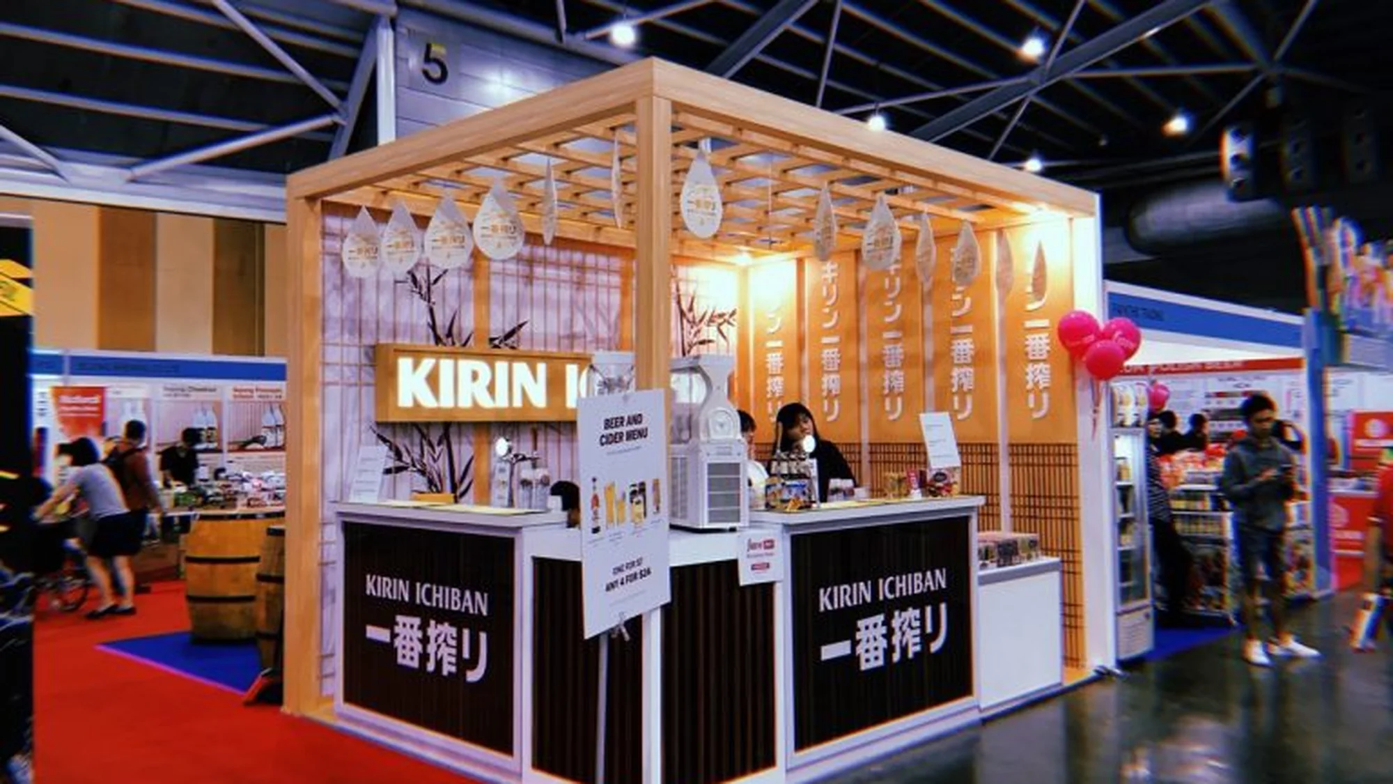 A Kirin Ichiban brand activation: a tasting booth with Japanese lettering, beer taps and a menu offering any four drinks for 24 dollars.
