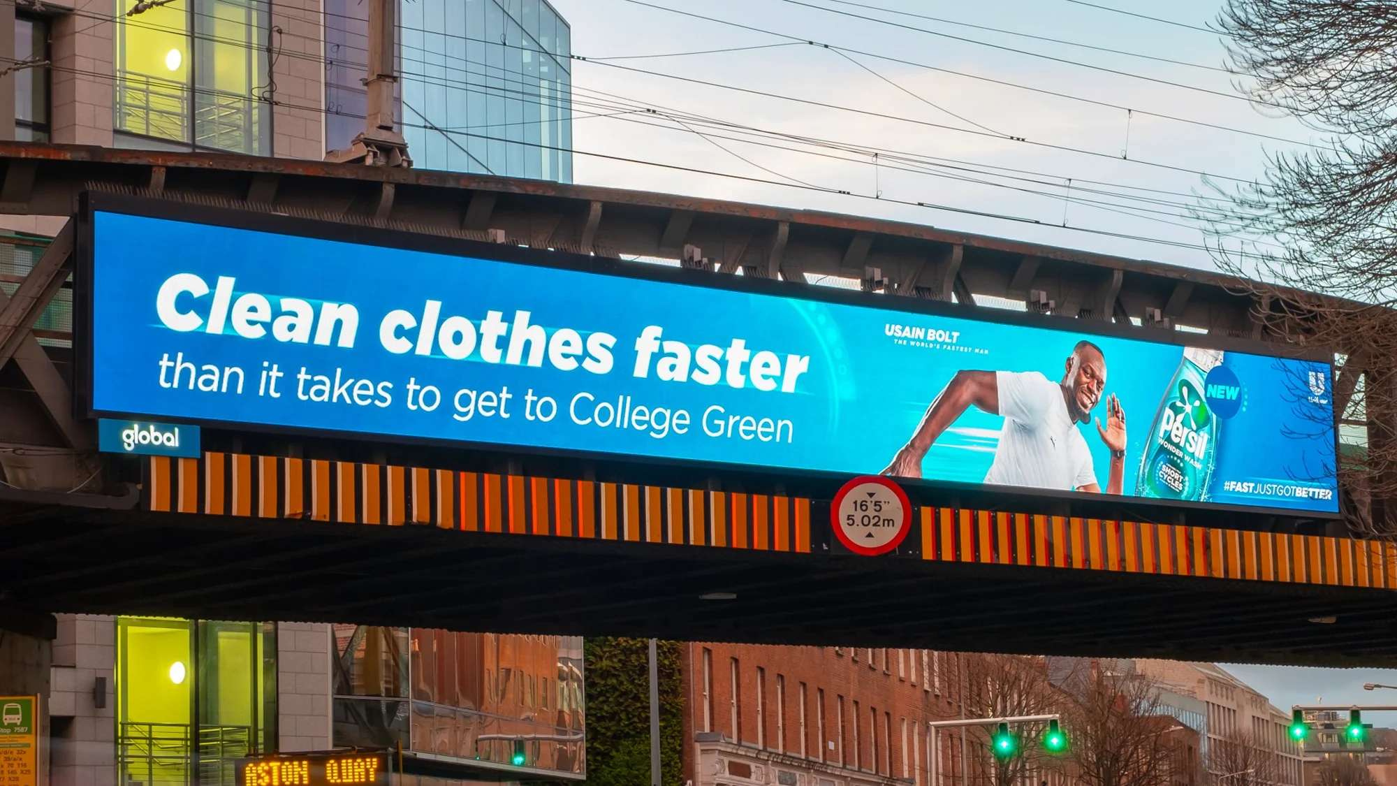 Digital billboard advertising in Ireland: a screen above a SPAR shop advertises Skyr with the lines This is breakfast and Naturally high in protein.