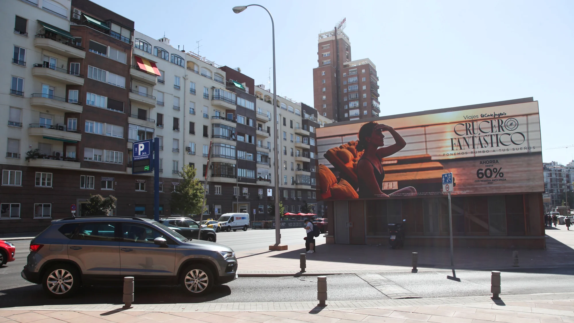 Billboard advertising on Gran Vía in Madrid, Spain: a Tommy Hilfiger Gigi board shows a woman in sunglasses.