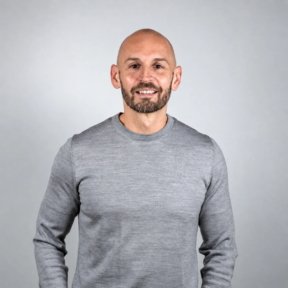 Portrait of Ty, Commercial Director for the Americas at OOH Global.