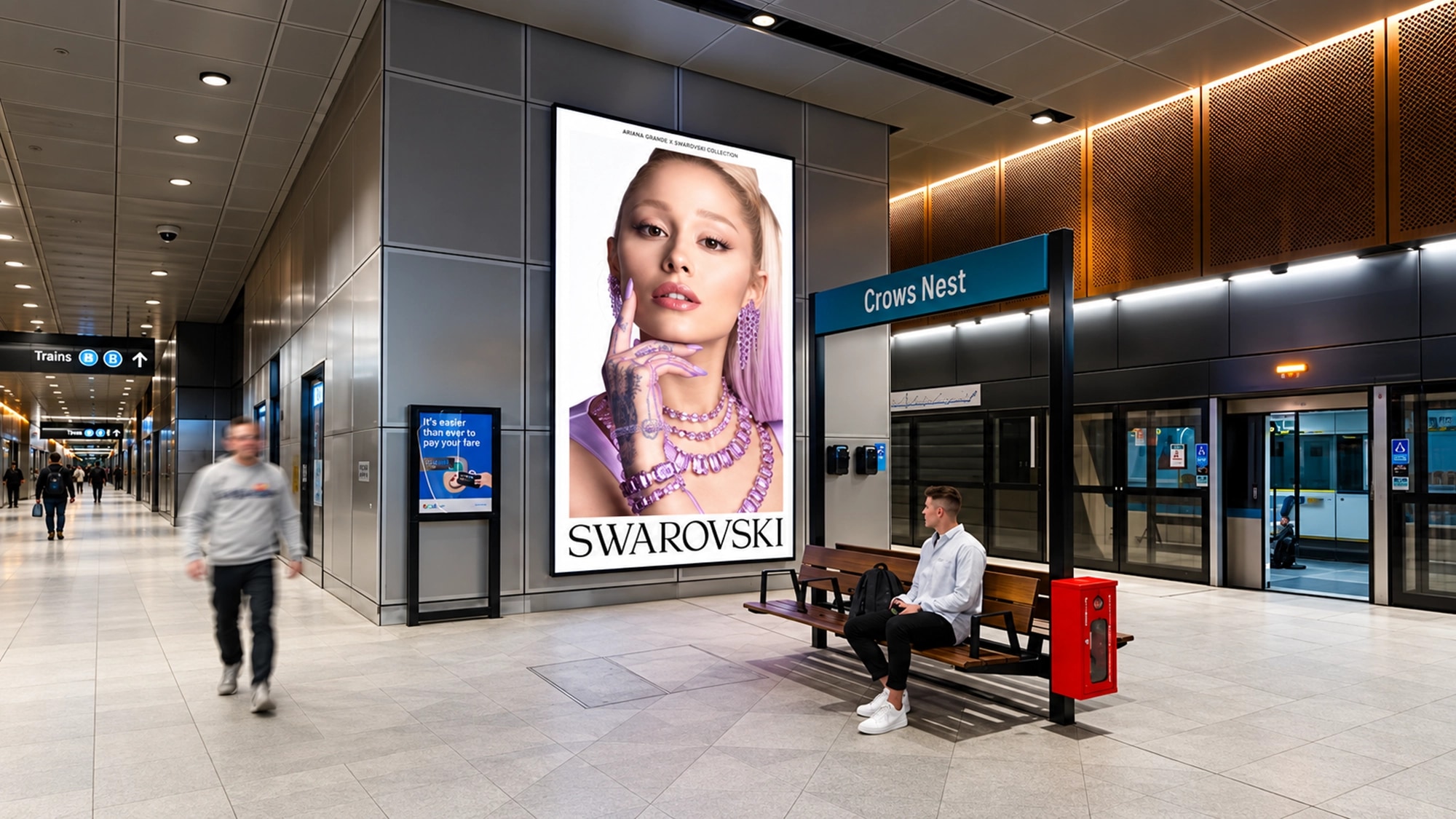Underground advertising in Australia: platform screens spell Annie Are You Okay.