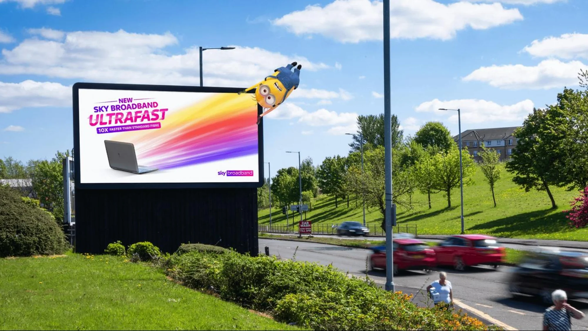 Billboard advertising in Ireland: a roadside board advertises Sky Broadband Ultrafast, with a Minion bursting out of the panel on a streak of colour.