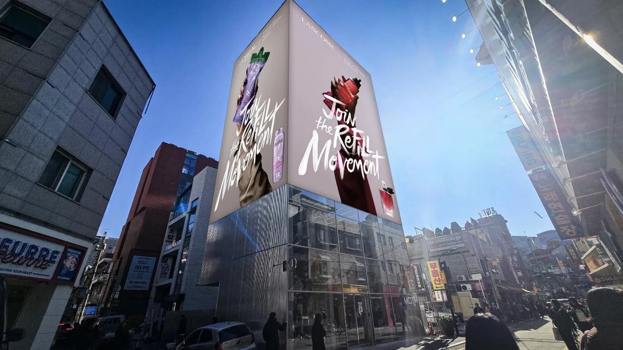 Building banner advertising: a Lancôme cube banner reading Join the Refill Movement tops a glass building.