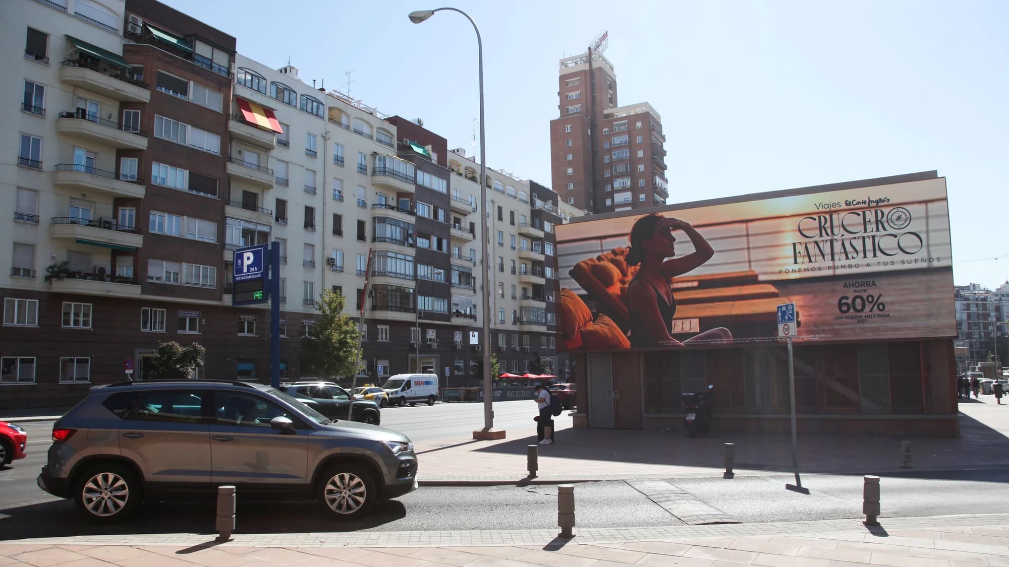 Billboard advertising on Gran Vía in Madrid, Spain: a Tommy Hilfiger Gigi board shows a woman in sunglasses.