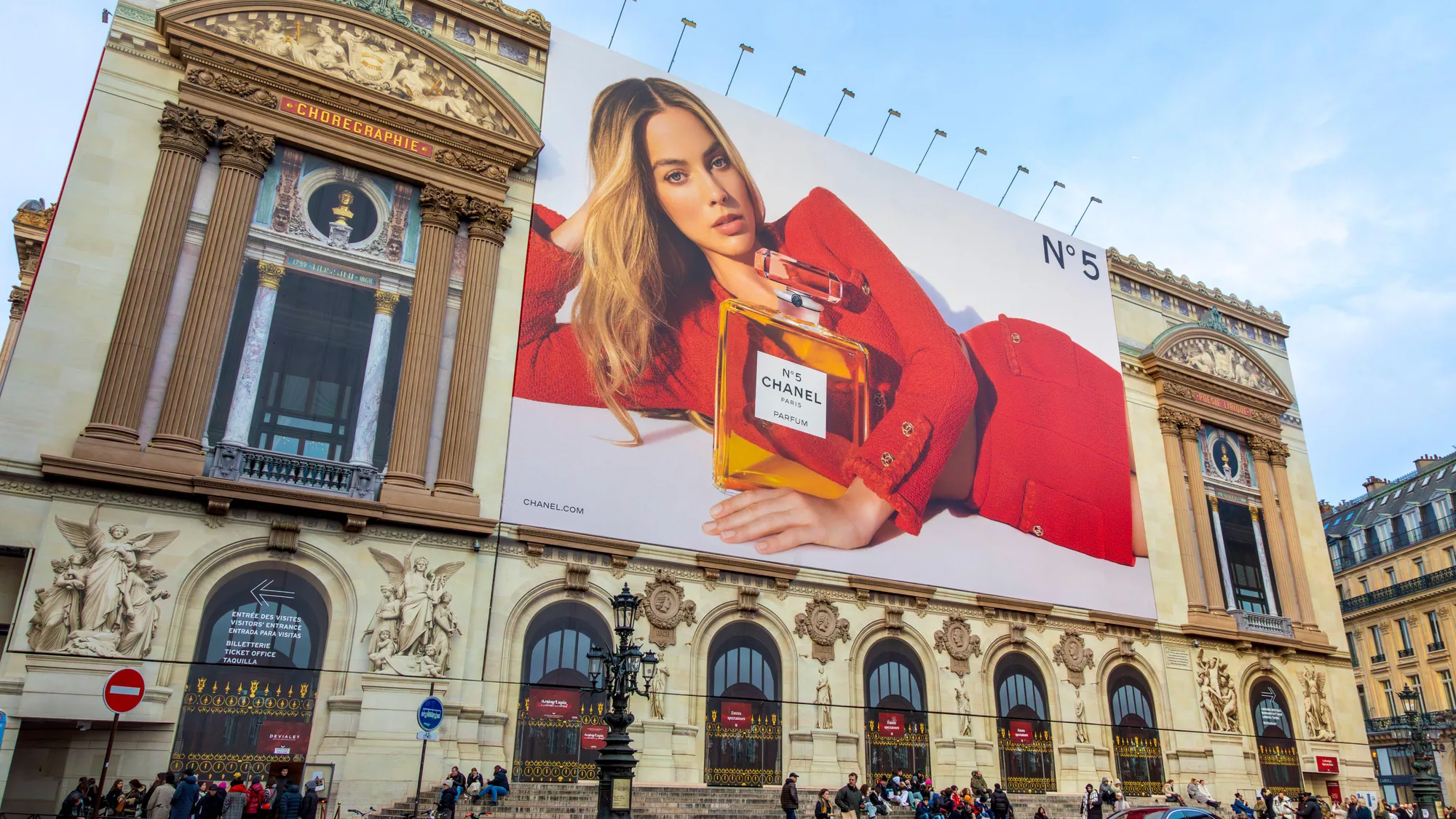 Large format banner advertising in Paris, France: a Chanel Coco Mademoiselle banner covers the facade of the Paris Opera.