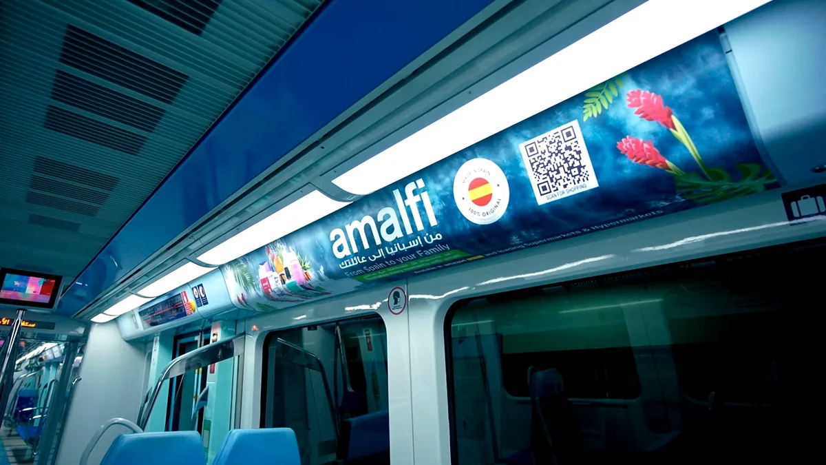 Tram interior advertising: an Amalfi advert runs along the ceiling panel inside a carriage.